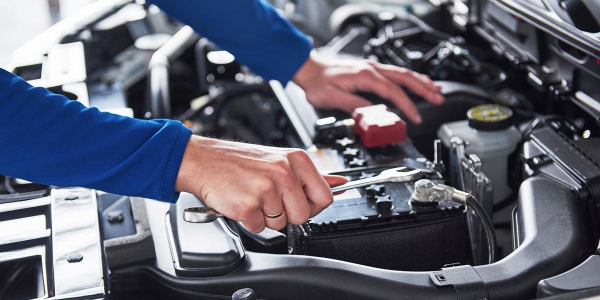 Service Technician working on an engine - Finnegan Buick GMC in Rosenberg TX