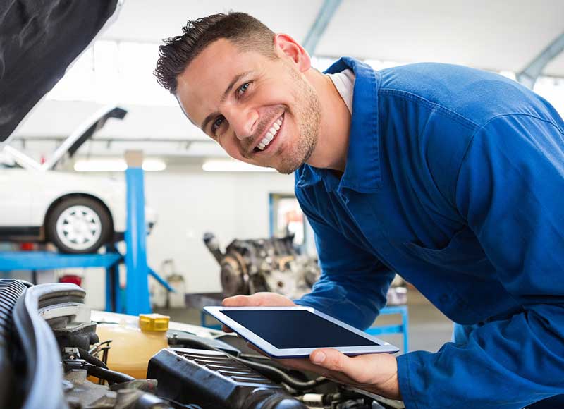 Service Technician smiling - Finnegan Buick GMC in Rosenberg TX